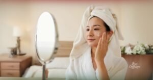 Woman applying moisturizer during her daily skin care routine