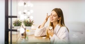 Woman applying vegan skincare cream for radiant and healthy skin