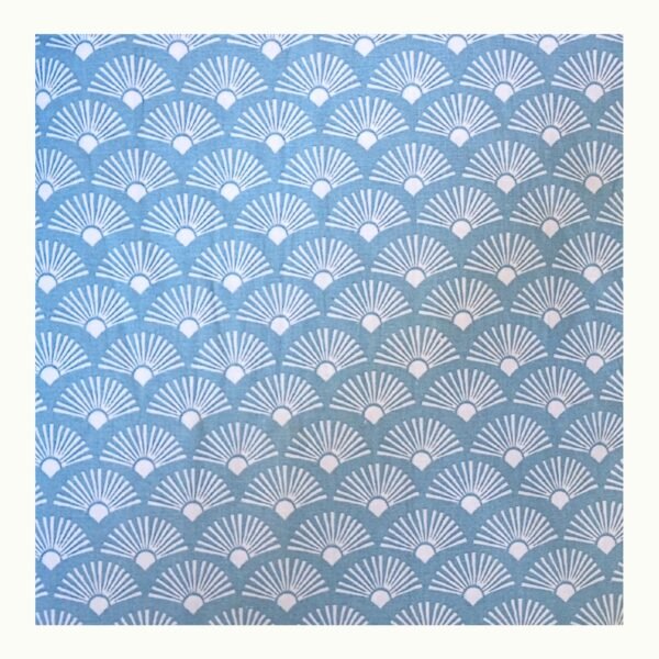 Closeup view of blue printed double bed bedsheet showing decorative fan pattern on soft cotton blend fabric.