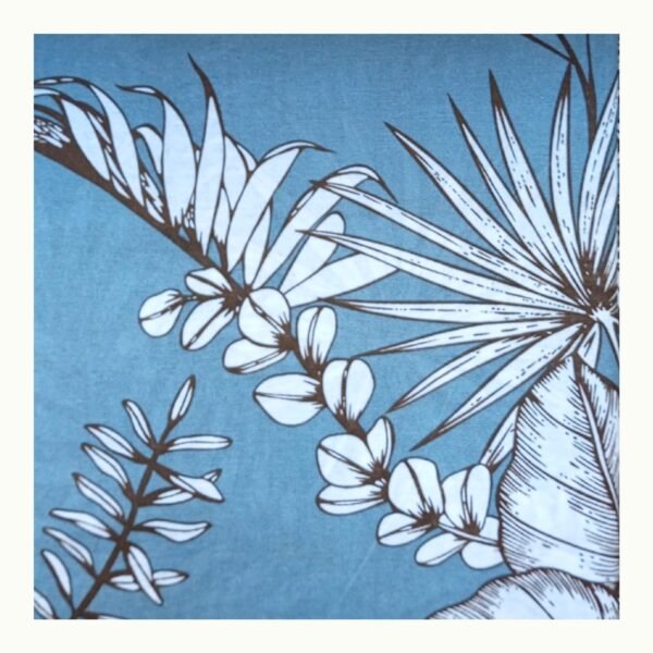 Closeup view of Botanical Double Bed Bedsheet showing soft cotton blend fabric with teal blue background and white floral print