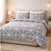 Printed double bed bedsheet set with modern grey geometric pattern styled on bed creating minimal and stylish bedroom decor.