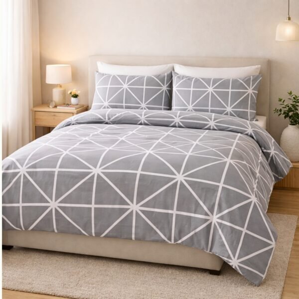 Printed double bed bedsheet set with modern grey geometric pattern styled on bed creating minimal and stylish bedroom decor.