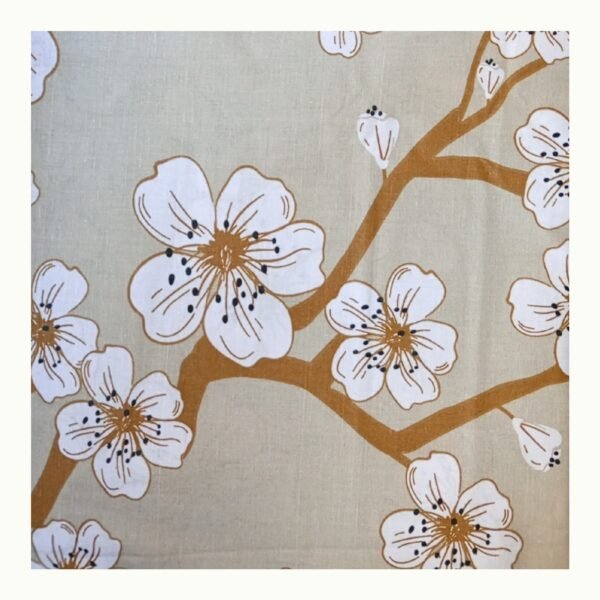 Closeup blossom double bed bedsheet pattern showing soft cotton blend fabric with beige background and delicate white flowers